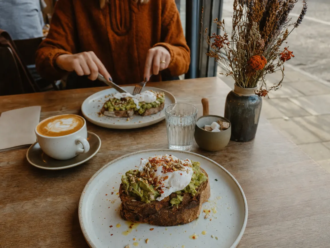 Smashed avocado on sourdough with a flat white